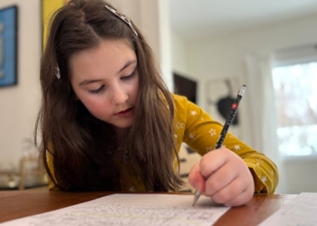 girl writing with a pen