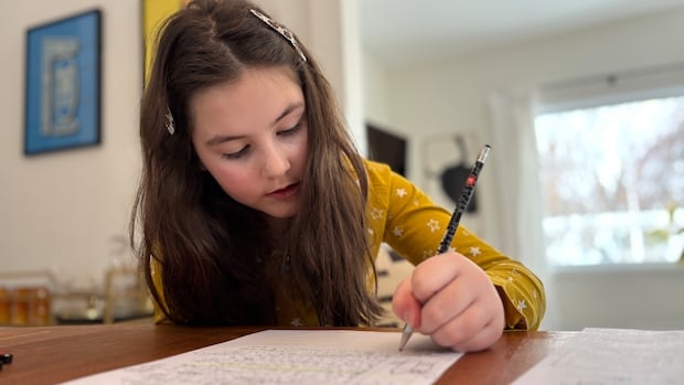 girl writing with a pen