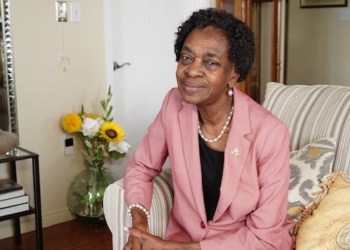 A woman looks at the camera