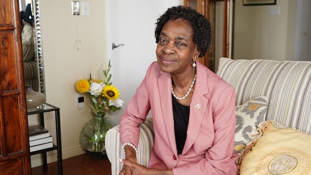 A woman looks at the camera