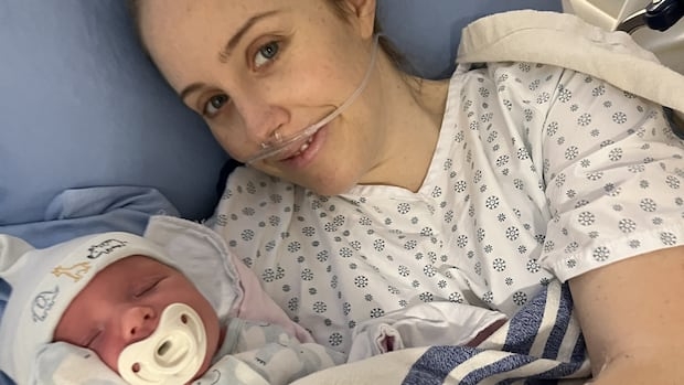 Paige Eaton shown in hospital with her son Archie. After his birth she developed severe pain, chills, and a fever and was eventually diagnosed with sepsis.