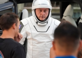 An astronaut speaks as leaves for a trip to the Kennedy Space Center's Launch Pad 39-A and a planned liftoff on a SpaceX Falcon 9 rocket Aug. 1, 2025, in Cape Canaveral , Fla.