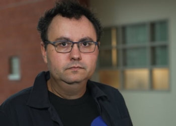 A man stares straight into the camera.