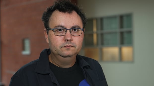 A man stares straight into the camera.