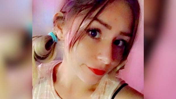 A young woman takes a selfie