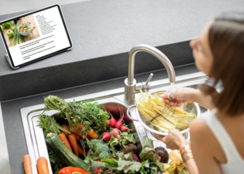 girl washing vegetables
