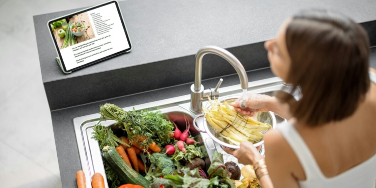 girl washing vegetables
