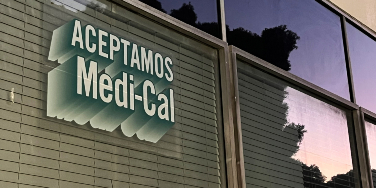 A sign printed on a window reads "Aceptamos Medi-Cal."