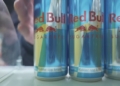 hand reaches for cans