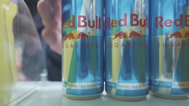hand reaches for cans